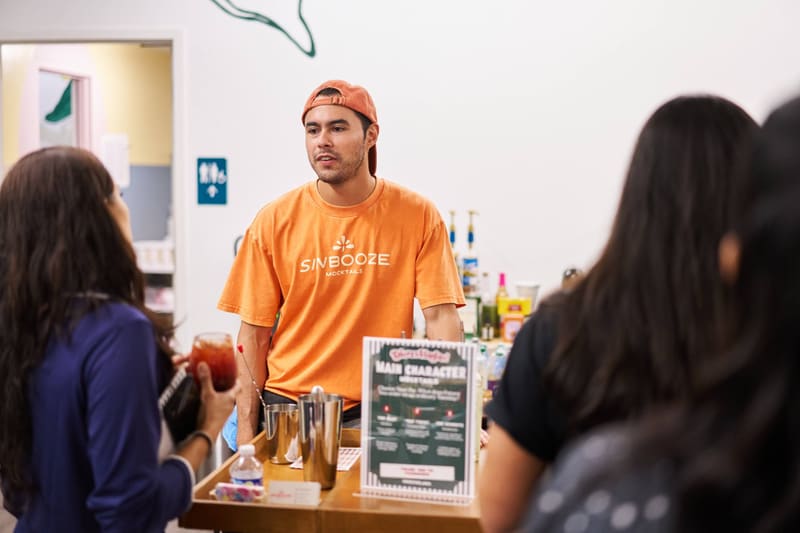 Guests chat with Aldo at the Sin Booze bar